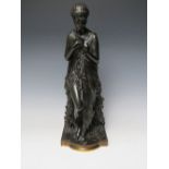 AFTER THOMAS NELSEN MACLEAN, a bronze study of a classical maiden with a dove in her right hand,