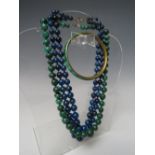 A VINTAGE DOUBLE STRAND LAPIZ LAZULI GRADUATED BEAD NECKLACE, together with a graduated hand-knotted