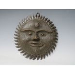 AN EARLY CIRCULAR BRONZE WALL HANGING STUDY OF A SUN GOD, possibly South American, Dia. 27 cm