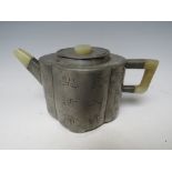A PEWTER AND JADE ORIENTAL TEAPOT, with character marks to exterior panels and single internal