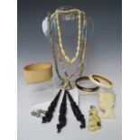 A SMALL SELECTION OF AFRICAN CARVED BONE JEWELLERY, to include a brooch, pendant etc., together with