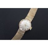 A VINTAGE LADIES 9 CARAT GOLD TISSOT WRIST WATCH, approx weight 20g, Dia 2 cm