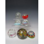 A COLLECTION OF FIVE MILLEFIORI GLASS PAPERWEIGHTS, varying is size and age, to include a large