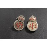 TWO NUMBERED A.F.S. SILVER BADGES