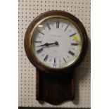 A WOODEN CASED QUARTZ WALL CLOCK