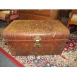 A VINTAGE TIN TRUNK