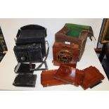 AN ANTIQUE WOODEN PLATE STYLE CAMERA TOGETHER WITH A LATER MENTOR EXAMPLE