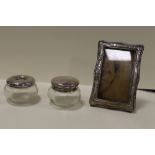 TWO CHESTER SILVER MOUNTED JARS & A SILVER PICTURE FRAME