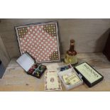 A QUANTITY OF VINTAGE BOARD GAMES TOGETHER WITH A CERAMIC WHISKY DECANTER