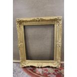A 19TH CENTURY GILTWOOD PICTURE FRAME WITH CARVED DETAIL, REBATE 53.5 X 44 CM