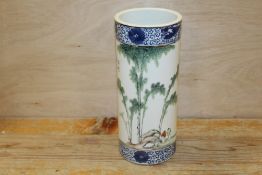 AN ORIENTAL SLEEVE VASE