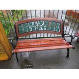 A METAL / CAST GARDEN BENCH