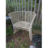 A MODERN METAL ARCHED GARDEN CHAIR