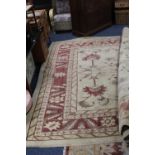 A LARGE WOOLLEN BEIGE RUG APPROX 360 X 304 CM