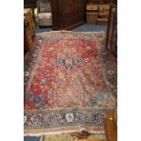 A LARGE EASTERN WOOLLEN RUG SALMON PINK WITH FLORAL DETAIL 320 X 216 CM