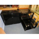 A MODERN HIGH GLOSS CABINET AND TWO GLASS TOP TABLES (3)