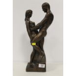 A BRONZE EFFECT MODEL OF A COUPLE