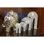 A COLLECTION OF SIX ASSORTED GRADUATING ELEPHANT FIGURES