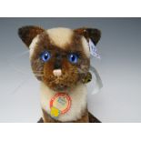 A STEIFF MOHAIR LIMITED EDITION 'SIAMY' SIAMESE CAT, with jointed head, white ear tag, No 401466,