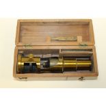 AN ANTIQUE STUDENTS MICROSCOPE WITH SLIDE & TWEEZERS