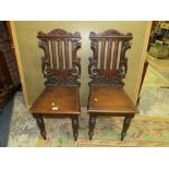 A PAIR OF ANTIQUE OAK CARVED HALL CHAIRS (2)