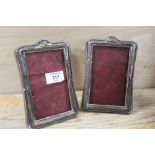 A PAIR OF SILVER PICTURE FRAMES A/F