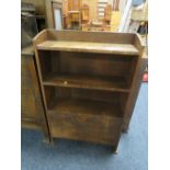 A VINTAGE OAK OPEN BOOKCASE WITH PAPER CUPBOARD BELOW W-64 CM