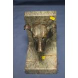 A BRONZE SCULPTURE OF A DOGS HEAD MOUNTED ON A MARBLE STAND