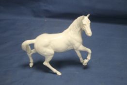 A ROYAL DOULTON HORSE (POSSIBLY DESSERT ORCHID)