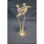 AN UNUSUAL ART GLASS FIGURE OF A COUPLE EMBRACING