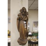 A CARVED WALL HANGING OF MADONNA AND CHILD