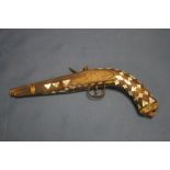 A SMALL OTTOMAN TYPE FLINT LOCK PISTOL WITH MOTHER OF PEARL INLAY