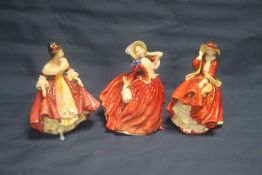 THREE ROYAL DOULTON FIGURINES TO INCLUDE |AUTUMN BREEZES, SOTHERN BELLE AND TOP O THE HILL|