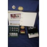 A COLLECTION OF BOXED COMMEMORATIVE AND OTHER COINS TOGETHER WITH AN ALBUM OF FIRST DAY COVERS