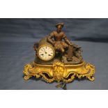 A VINTAGE METAL AND GILT MANTLE CLOCK