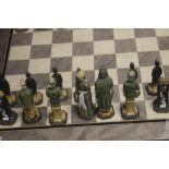 A UNBOXED STUDIO ANNE CARLTON CHESS SET |AMERICAN INDEPENDENCE|