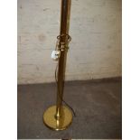 A BRASS FLOOR STANDING STANDARD LAMP