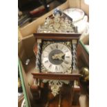 A REPRODUCTION WALL CLOCK WITH BRASS WEIGHTS