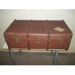 A FOUR BANDED STEAMER TRAVEL TRUNK