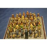 A UNBOXED STUDIO ANNE CARLTON CHESS SET TOGETHER WITH ANOTHER, TO INCLUDE CRUSADES AND VIKINGS