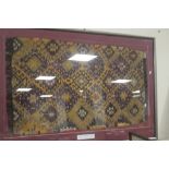 A FRAMED AVANOS TURKISH RUG 105 CM X 75 CM