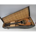 A VINTAGE CASED 8 STRING MANDOLIN WITH INTERIOR LABEL