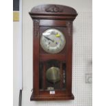 A VINTAGE MAHOGANY WALL CLOCK