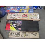 FOUR BOXED R/C MODEL AIRCRAFT SETS COMPRISING A FLAIR BLACK MAGIC SET, A PRECEDENT FUN FLY, A VIVI