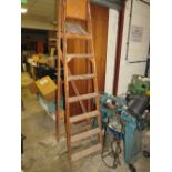 A SET OF VINTAGE WOODEN STEP LADDERS