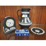 A WEDGWOOD BLACK JASPERWARE JUG, SMALL DESK CLOCK AND PIN DISH TOGETHER WITH A BLUE DIP LIDDED