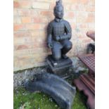 A CONCRETE BLACK ORIENTAL KNEELING WARRIOR ON PLINTH - H 104 CM WITH A BRIDGE