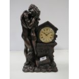 A BRONZED STYLE RESIN FIGURAL MANTEL CLOCK