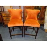 A PAIR OF MODERN BURNT ORANGE BAR / KITCHEN STOOLS