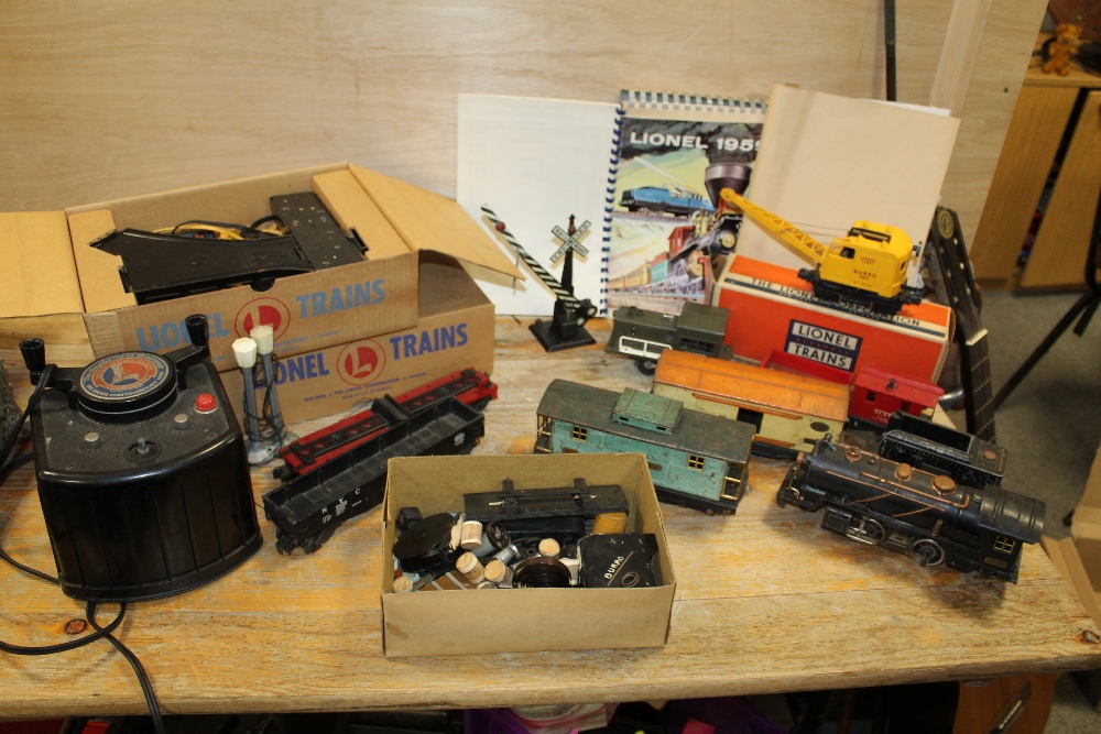 A LIONEL TRAINS O GAUGE ELECTRIC TRAIN SET INCLUDING A PIGGY BACK TRANSPORTATION SET, LOCOMOTIVES